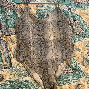 Gaze snake skin body suit.